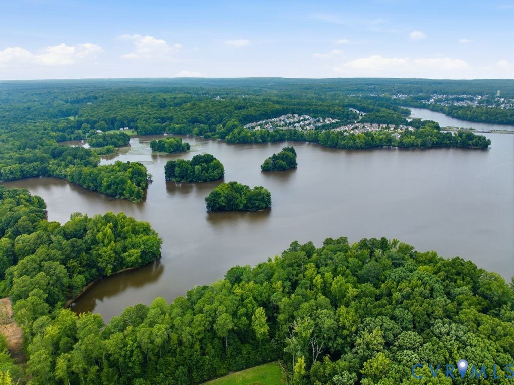 Extensive waterfront property featuring mature tree lines, a substantial body of water, and natural island formations