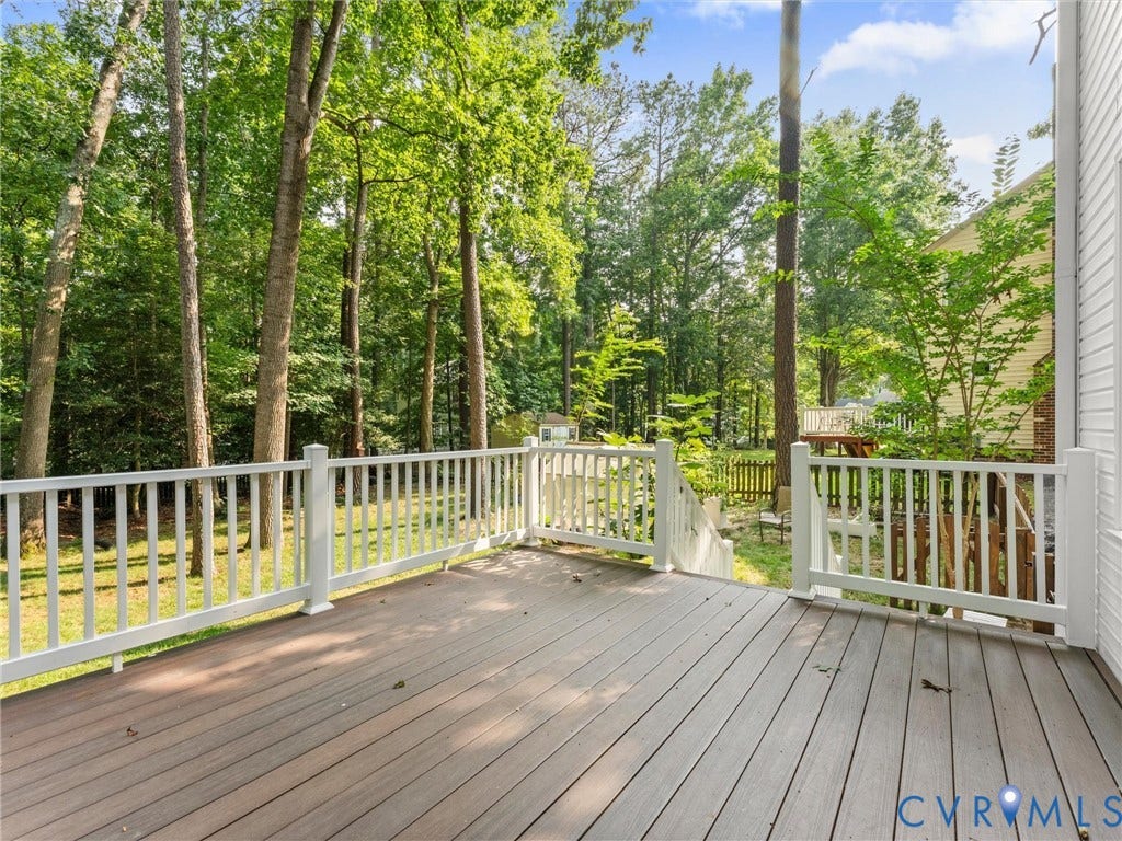 13915 Highpaige Way, Stoney Glen West, Chester, VA 23831 Spacious outdoor deck featuring composite decking and white railing, surrounded by mature trees