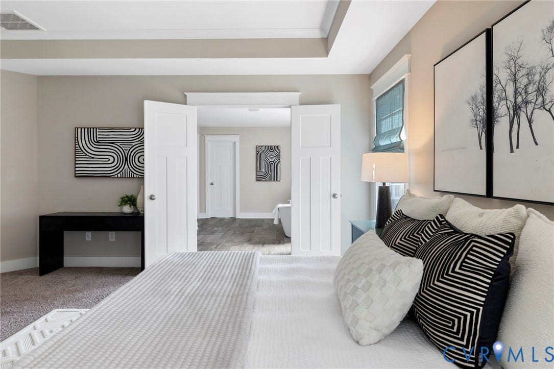 6984 Carden Park Drive, Moseley, VA 23120 Tray ceiling with recessed lighting and a window featuring a Roman shade
