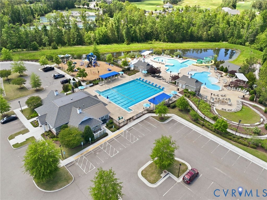 6984 Carden Park Drive, Moseley, VA 23120 Expansive aquatic center featuring a multi-lane lap pool, free-form leisure pool, and splash pad