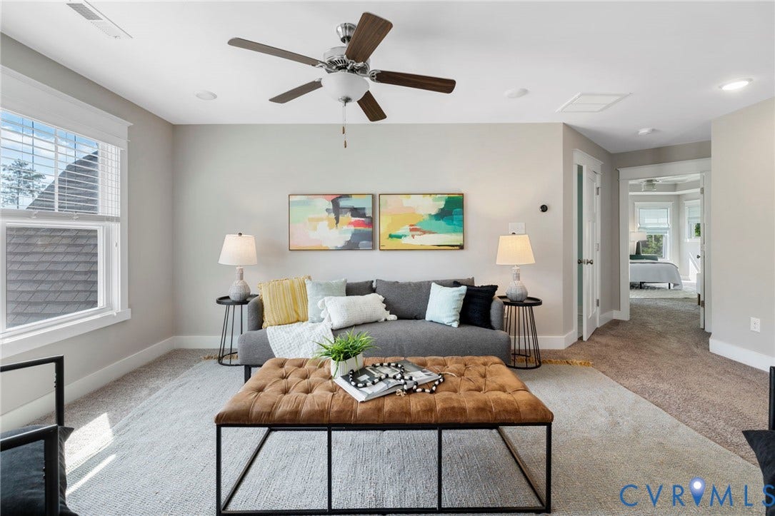 6984 Carden Park Drive, Moseley, VA 23120 Carpeted living area featuring a ceiling fan with integrated lighting, recessed lighting, and a large window with blinds