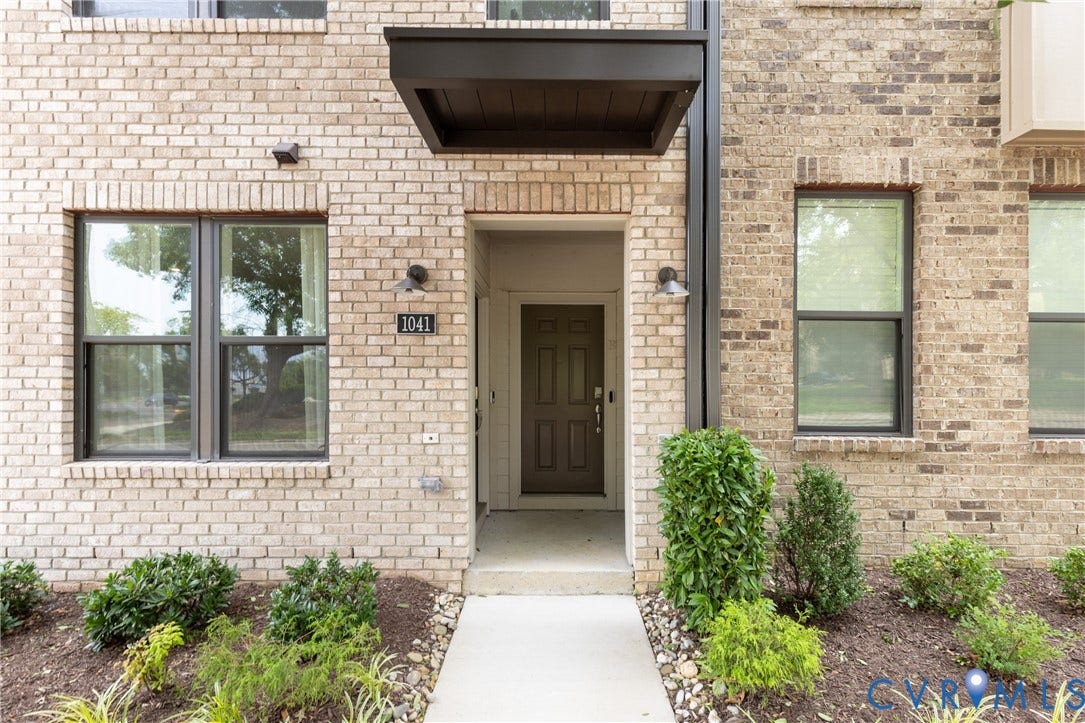 1041 N Lombardy Street, #A, Carver Square, Richmond, VA 23220 Brick exterior featuring a covered entryway & mature landscaping