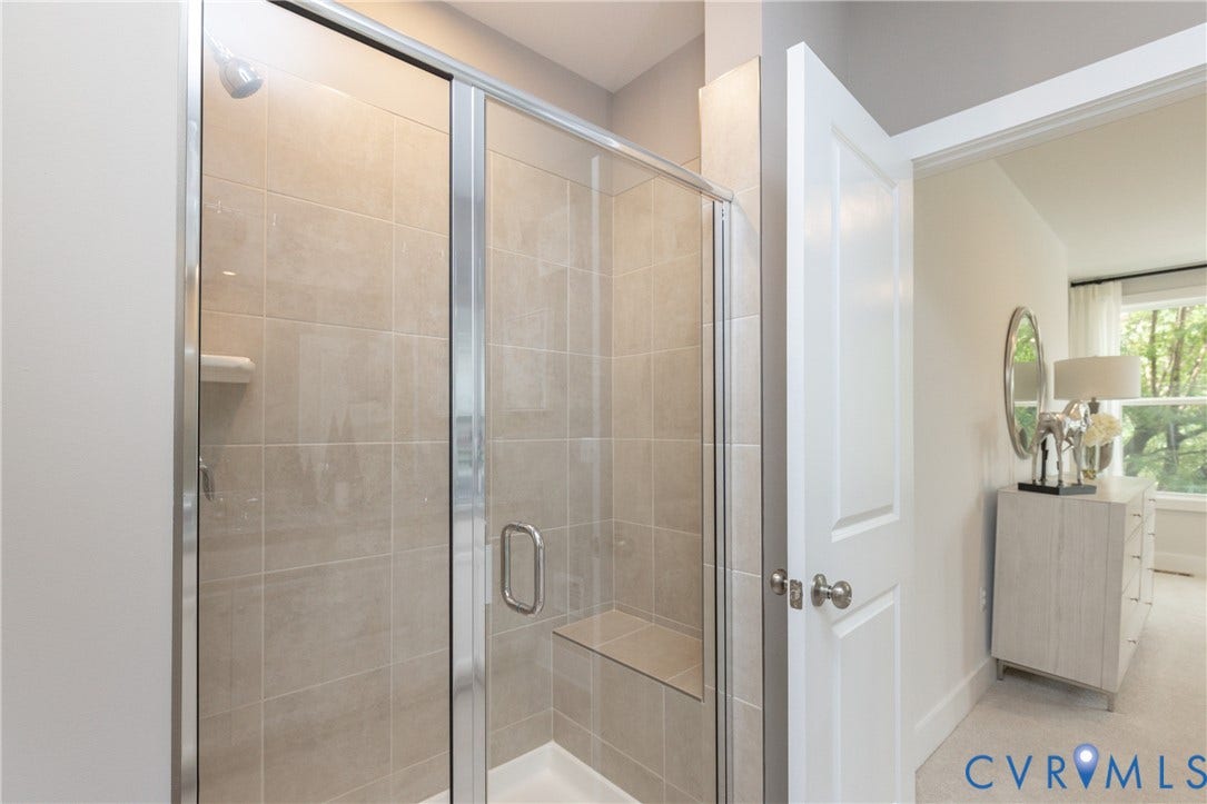 1041 N Lombardy Street, #A, Carver Square, Richmond, VA 23220 Glass-enclosed shower with a tiled interior, built-in bench