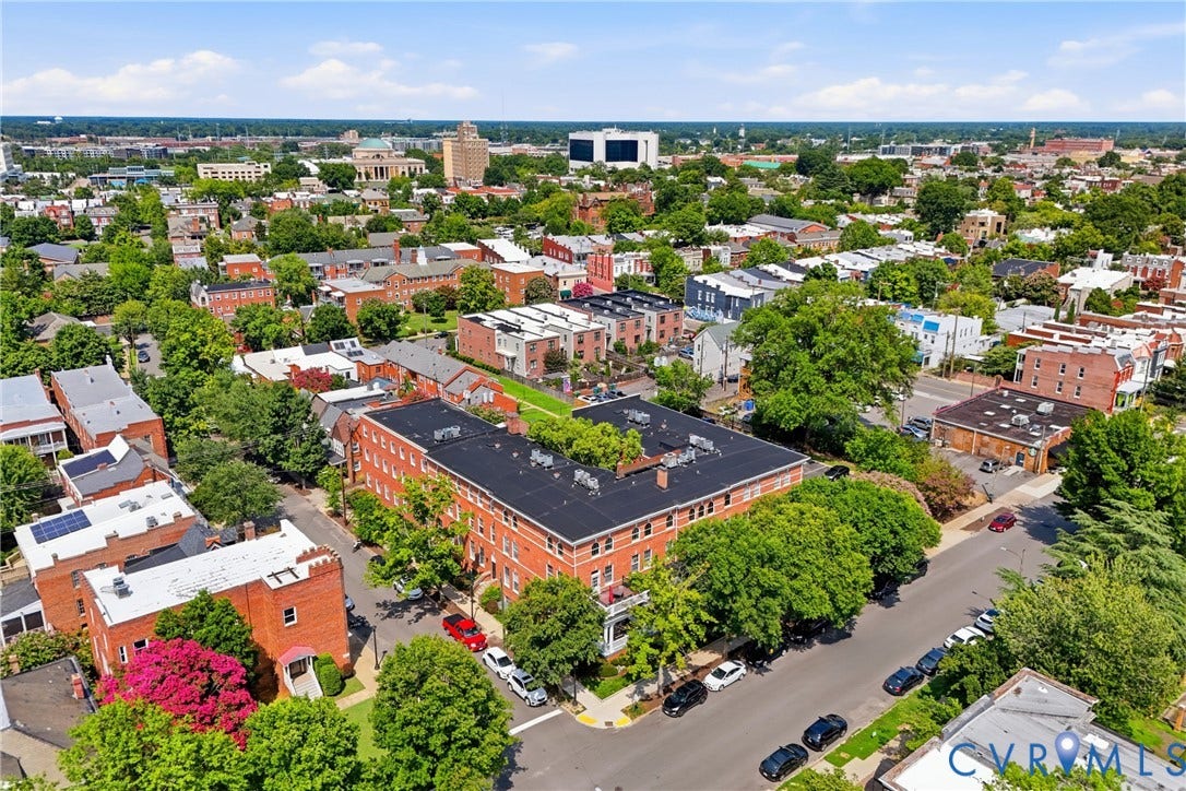 Urban aerial view showcasing a dense residential area with mature trees
