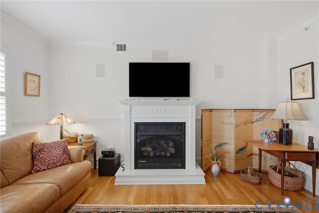 Fireplace with a decorative mantel and hearth