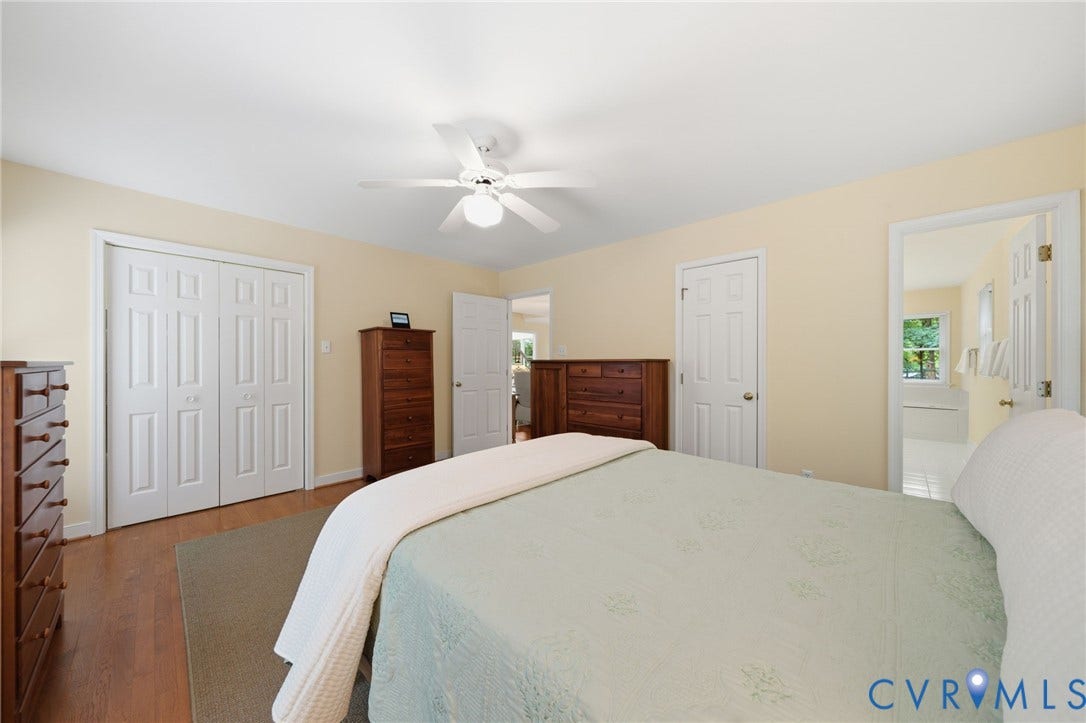 1902 Soldiers Lane, Crozier, VA 23039 Spacious room featuring wood-finish flooring, light-colored walls, and a white ceiling fan