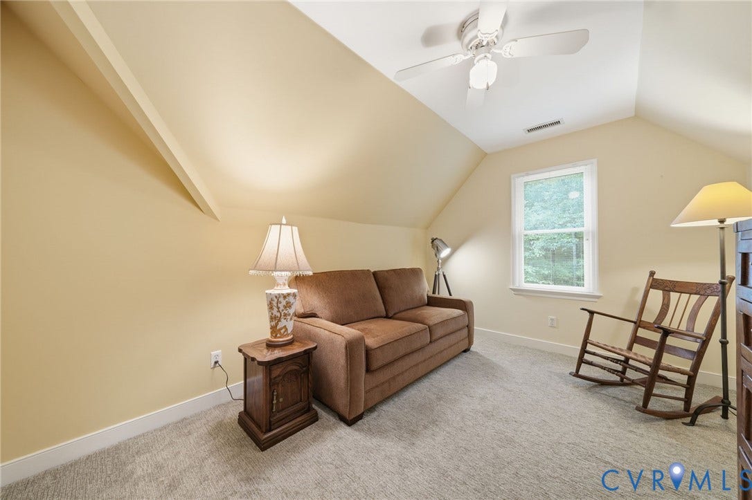 1902 Soldiers Lane, Crozier, VA 23039 Carpeted room with a peaked ceiling and a window providing natural light
