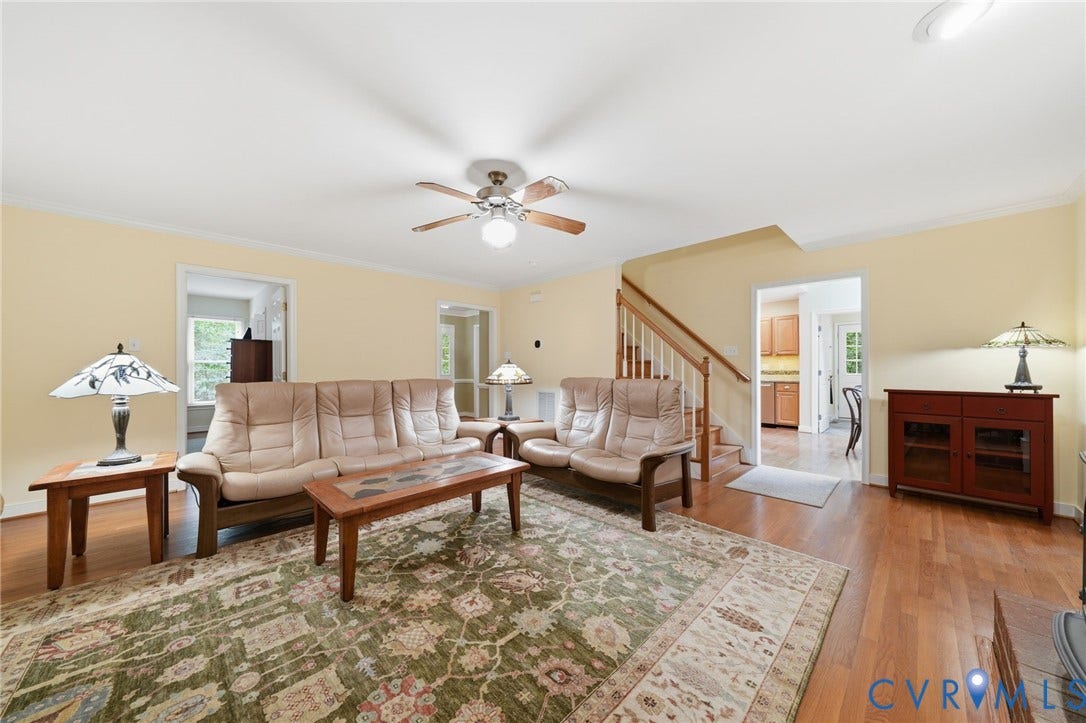 1902 Soldiers Lane, Crozier, VA 23039 Living area featuring wood-finish flooring, a ceiling fan with light, and a light-toned wall color