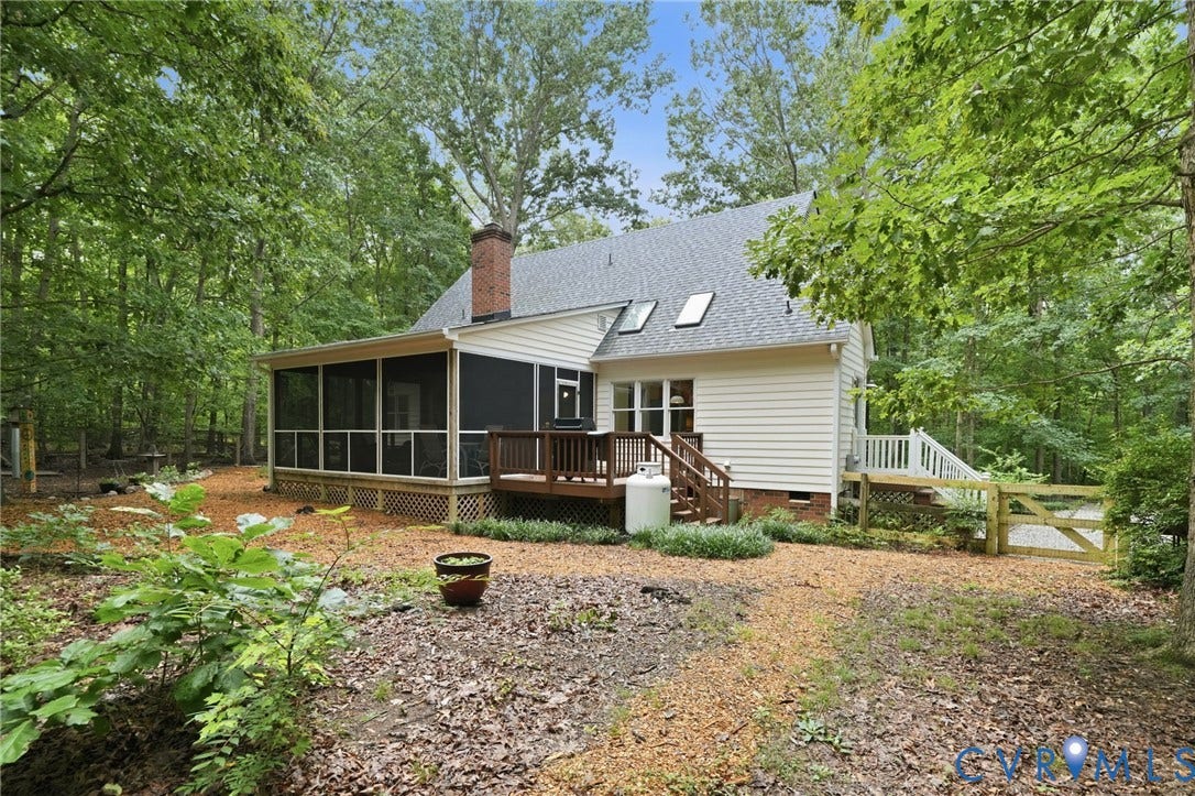 1902 Soldiers Lane, Crozier, VA 23039 Rear elevation featuring a screened porch, a wood deck, and multiple skylights