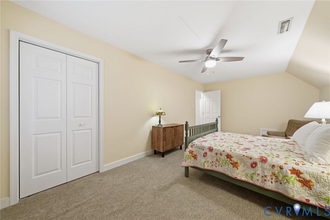 1902 Soldiers Lane, Crozier, VA 23039 Spacious room featuring neutral carpeting, light-toned walls, and a ceiling fan