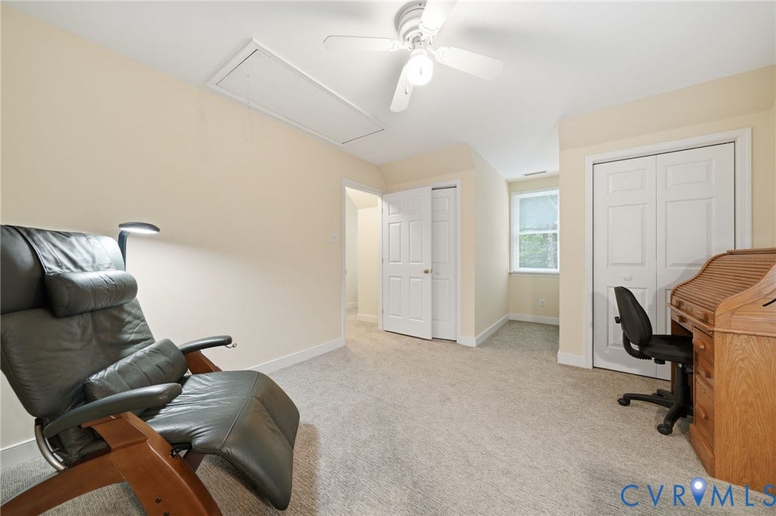 1902 Soldiers Lane, Crozier, VA 23039 Carpeted interior space featuring neutral wall tones, white trim, and a ceiling fan
