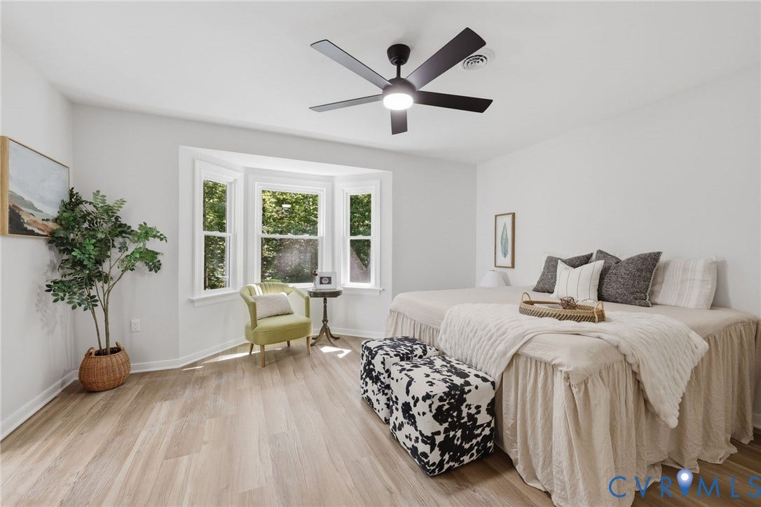 3457 Richards Run, Very Desirable!, Powhatan, VA 23139 Spacious room featuring wood-finish flooring, a contemporary ceiling fan, and a prominent bay window