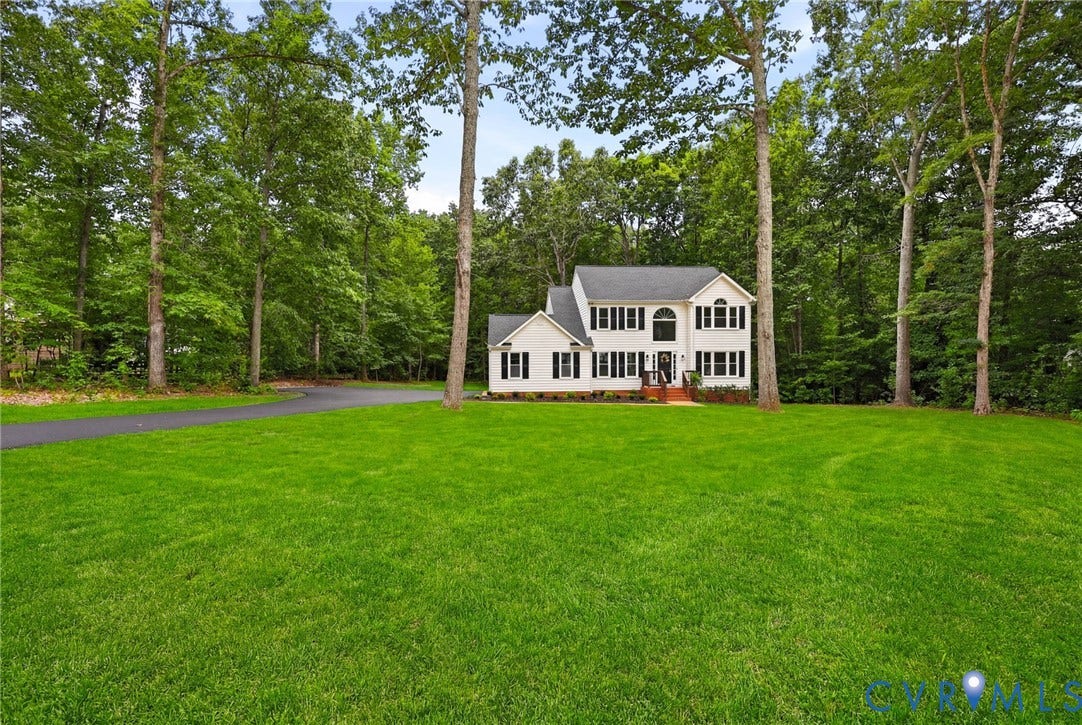 3457 Richards Run, Very Desirable!, Powhatan, VA 23139 Two-story residence with a classic white facade, dark shutters, and an arched window accent