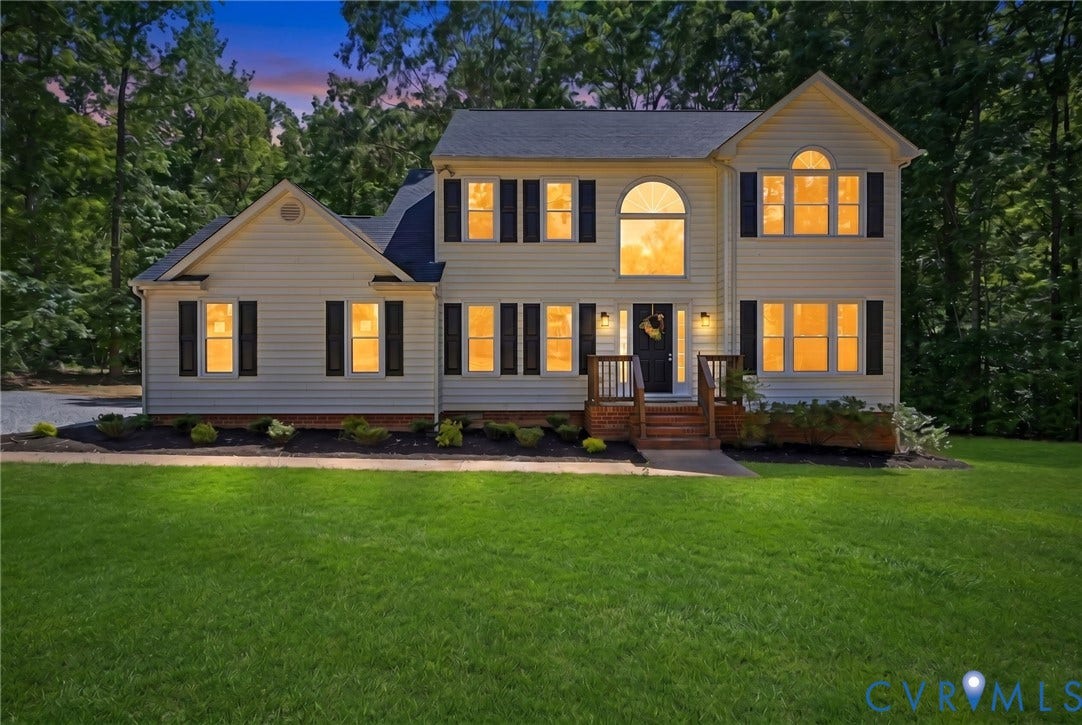3457 Richards Run, Very Desirable!, Powhatan, VA 23139 Traditional-style residence featuring light-colored siding, dark shutters, and a prominent arched window on the front facade