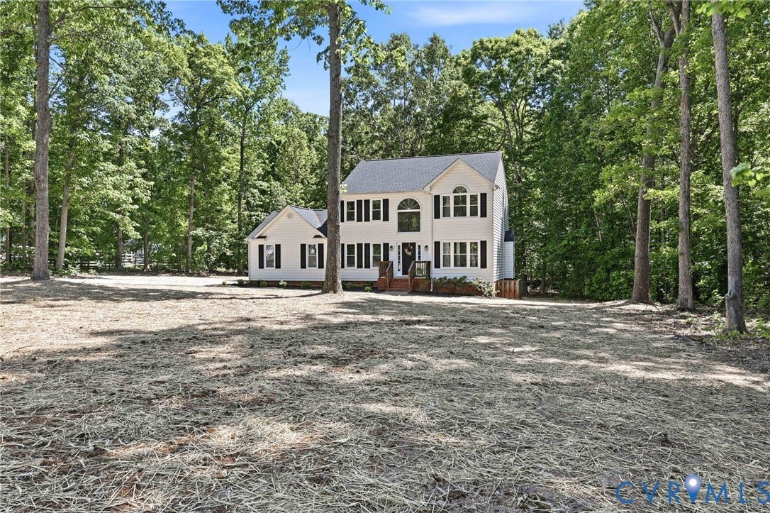 3457 Richards Run, Very Desirable!, Powhatan, VA 23139 Traditional two-story residence featuring a light-colored exterior with dark shutters, multiple windows, and a dark shingled roof