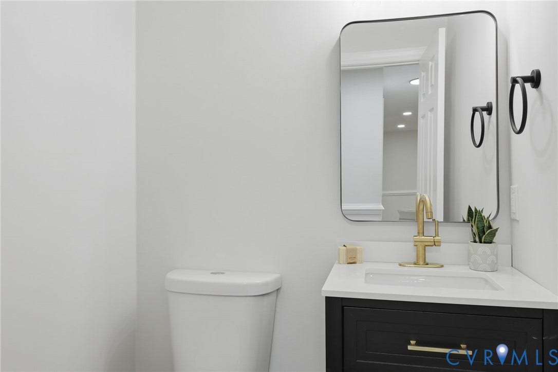 3457 Richards Run, Very Desirable!, Powhatan, VA 23139 Bathroom vanity featuring a quartz-style countertop, undermount sink, and gold-finish faucet