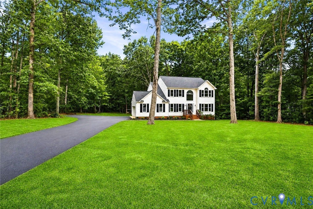 3457 Richards Run, Very Desirable!, Powhatan, VA 23139 Colonial-style exterior featuring a black shingle roof, white siding, and dark shutters