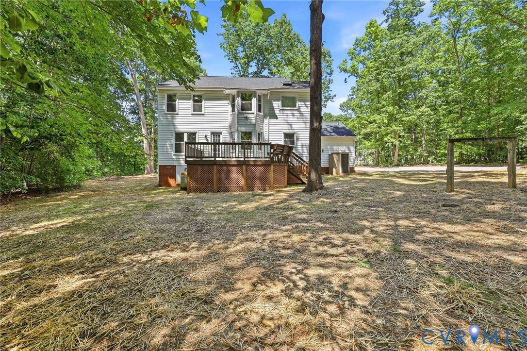 3457 Richards Run, Very Desirable!, Powhatan, VA 23139 Expansive backyard featuring a multi-level deck with lattice skirting, mature trees, and a detached structure