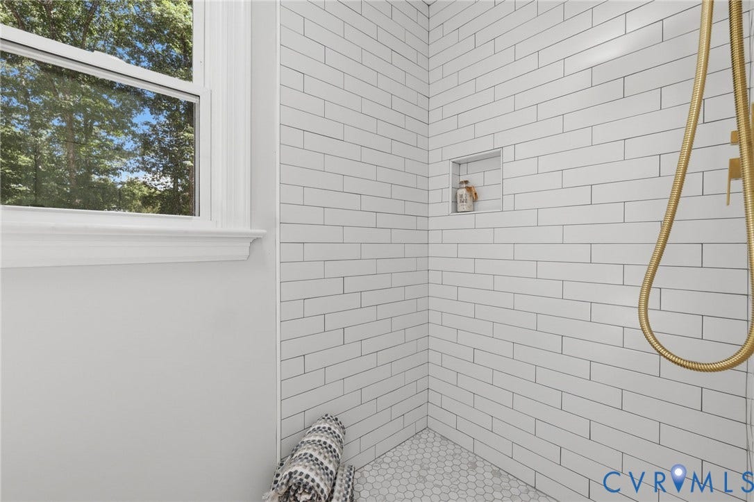 3457 Richards Run, Very Desirable!, Powhatan, VA 23139 Shower featuring white subway tile walls, a built-in shower niche, and a gold-finish shower head with handheld sprayer