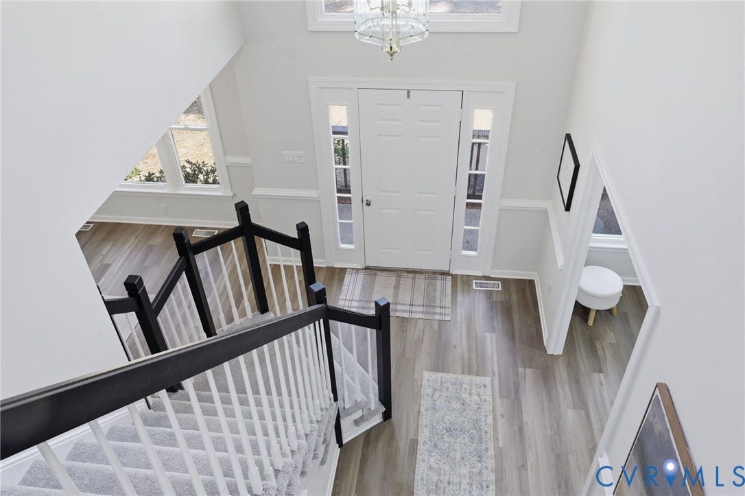 3457 Richards Run, Very Desirable!, Powhatan, VA 23139 Foyer with wood-finish flooring, a white paneled front door, and flanking sidelights