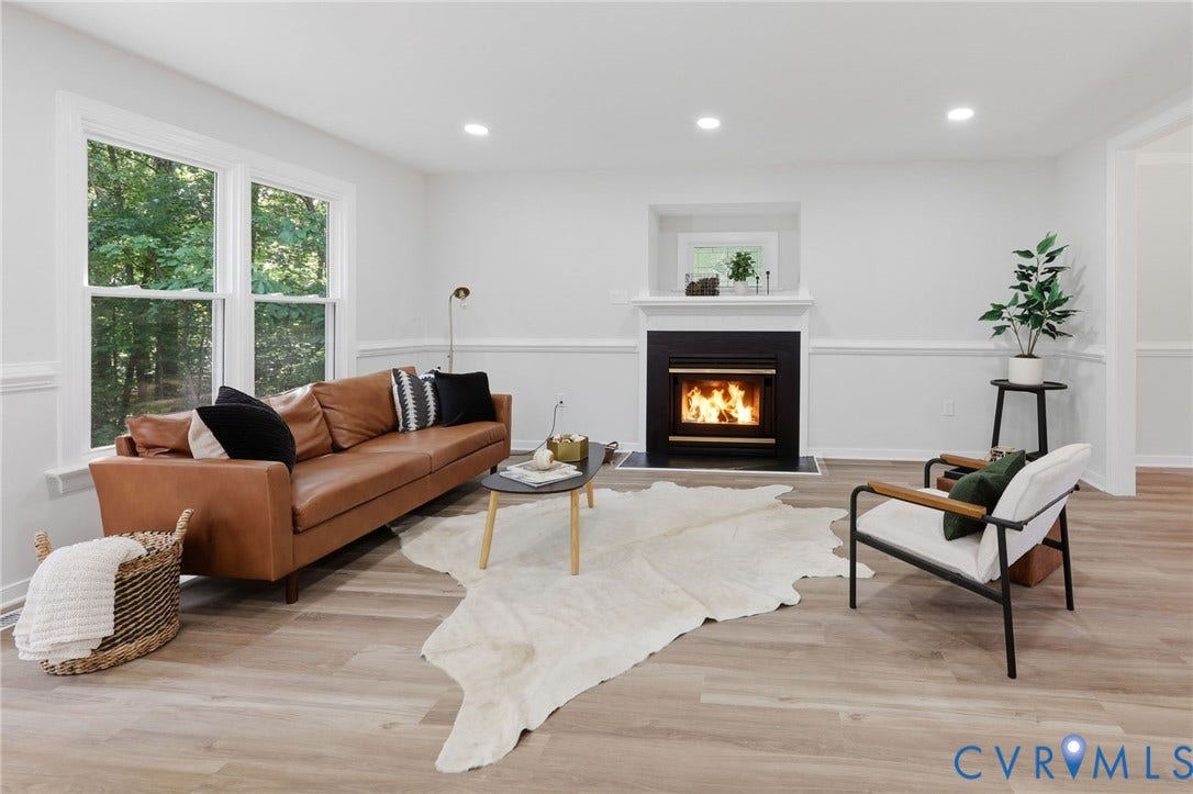 3457 Richards Run, Very Desirable!, Powhatan, VA 23139 Living room featuring a fireplace with a black surround and white mantel, wood-finish flooring, recessed lighting, and large windows