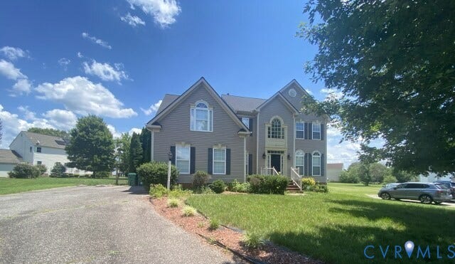 6521 Oakland Chase Place, Henrico, VA 23231 Two-story facade with gabled roof lines and gray siding