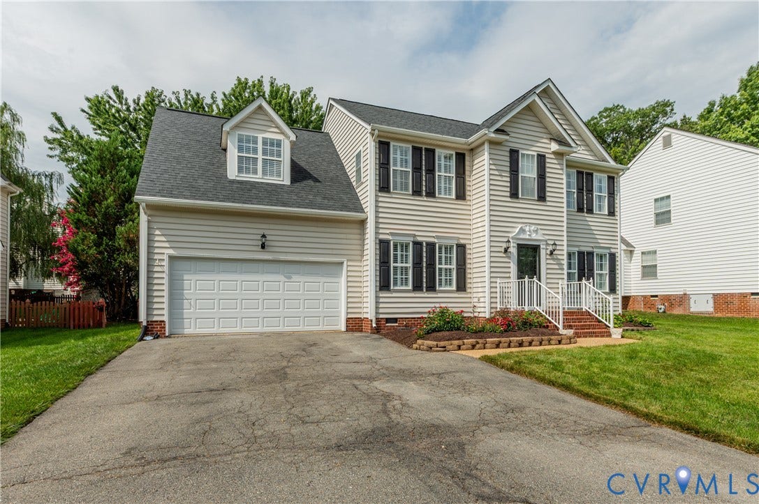 5117 Hart Mill Drive, Glen Allen, VA 23060 Two-story residence featuring siding exterior, a two-car garage, and a gabled roofline
