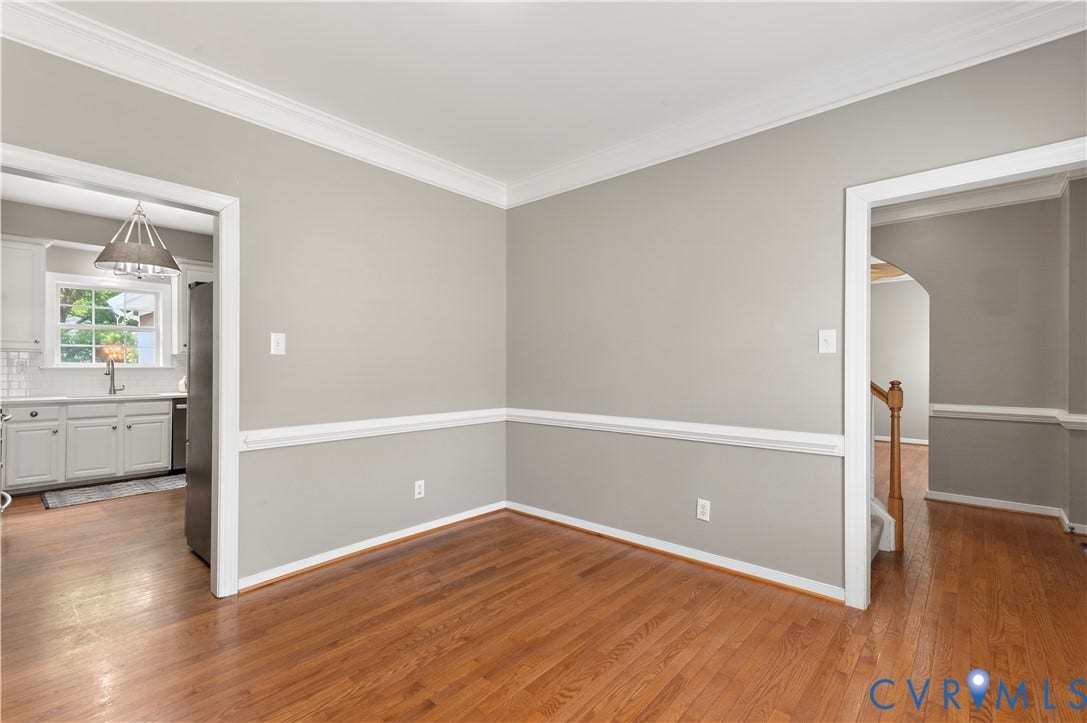 5117 Hart Mill Drive, Glen Allen, VA 23060 Hardwood flooring throughout, featuring detailed crown molding and chair rail accents