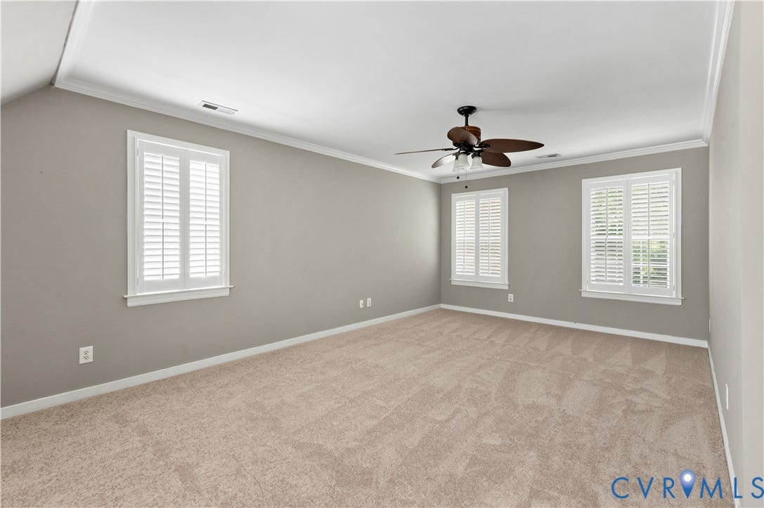 5117 Hart Mill Drive, Glen Allen, VA 23060 Spacious room featuring neutral carpeting, light gray walls, and crown molding