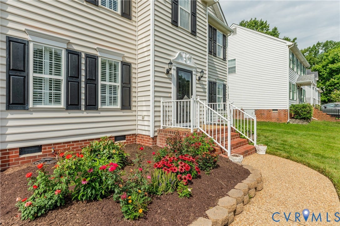 5117 Hart Mill Drive, Glen Allen, VA 23060 Exterior featuring light-colored siding, black window shutters, and a brick foundation