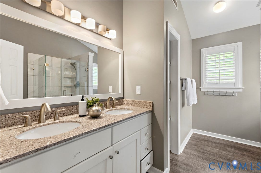 5117 Hart Mill Drive, Glen Allen, VA 23060 Dual vanity with stone-finish countertop, undermount sinks, and brushed nickel fixtures