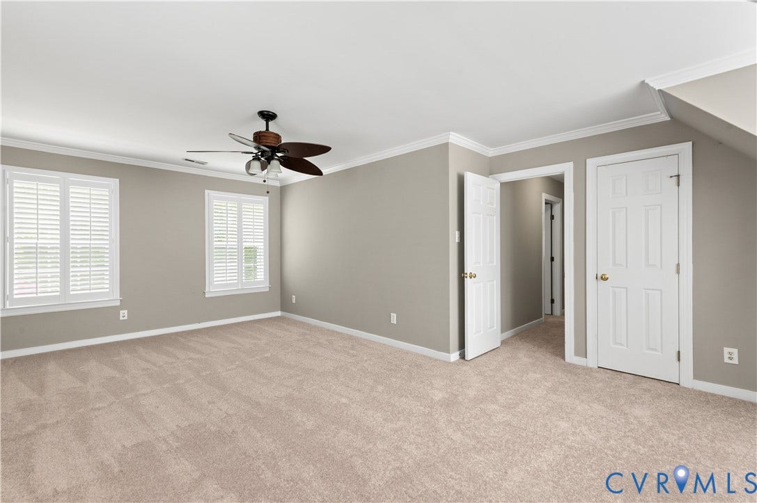 5117 Hart Mill Drive, Glen Allen, VA 23060 Spacious room featuring neutral wall tones, plush carpeting, and two windows with white plantation shutters