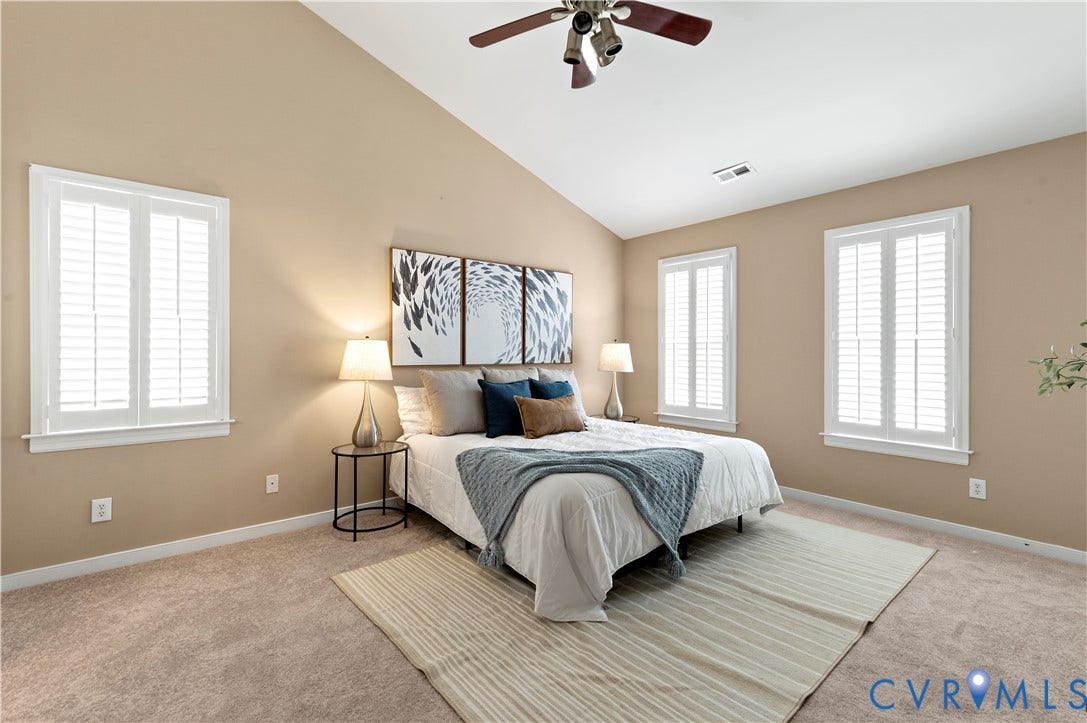 5117 Hart Mill Drive, Glen Allen, VA 23060 Vaulted ceiling with a ceiling fan, carpeted flooring, and plantation shutters on multiple windows