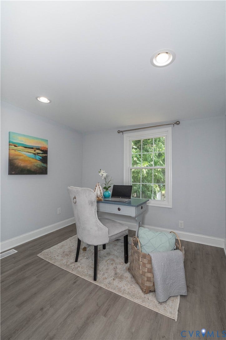 1209 N 22nd Street, Church Hill, Richmond, VA 23223 Recessed lighting illuminating a room featuring wood-finish flooring, light grey walls, and a multi-pane window