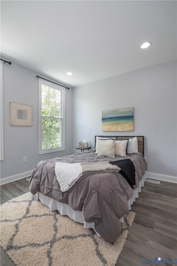1209 N 22nd Street, Church Hill, Richmond, VA 23223 Room featuring wood-finish flooring, recessed lighting, and a double-hung window with a black curtain rod