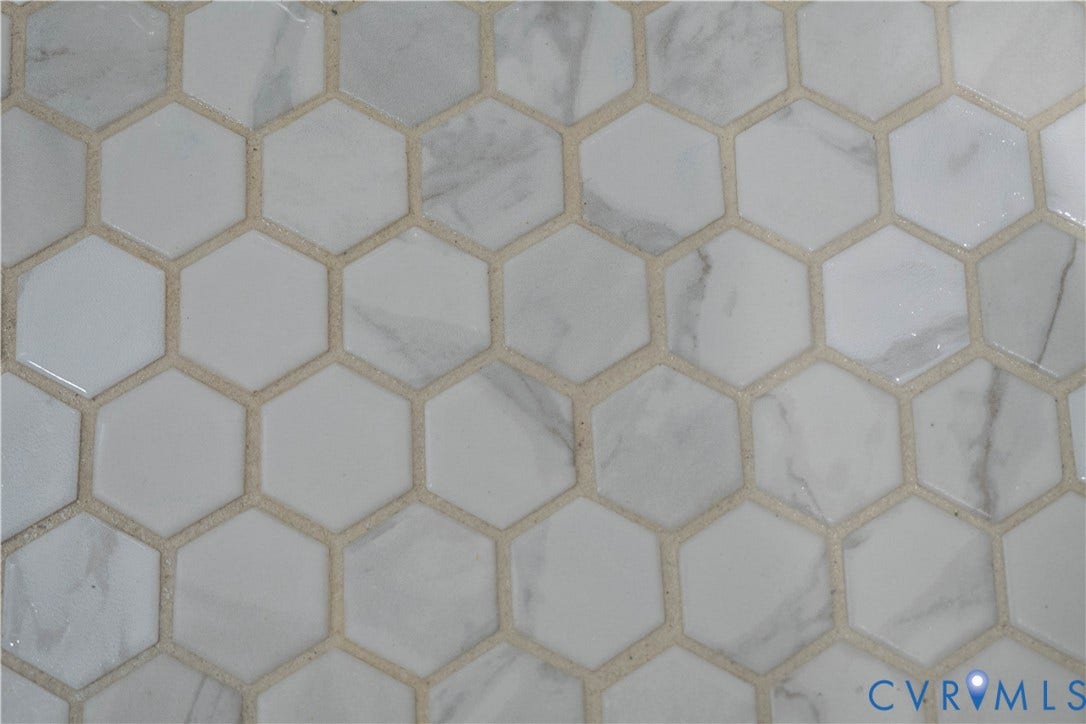 1209 N 22nd Street, Church Hill, Richmond, VA 23223 Hexagonal tile flooring featuring a blend of white and marbled grey tiles with light-colored grout