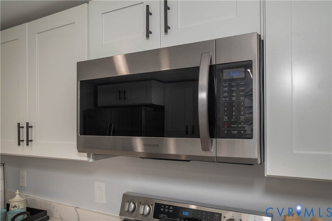 1209 N 22nd Street, Church Hill, Richmond, VA 23223 Stainless steel microwave positioned above a range