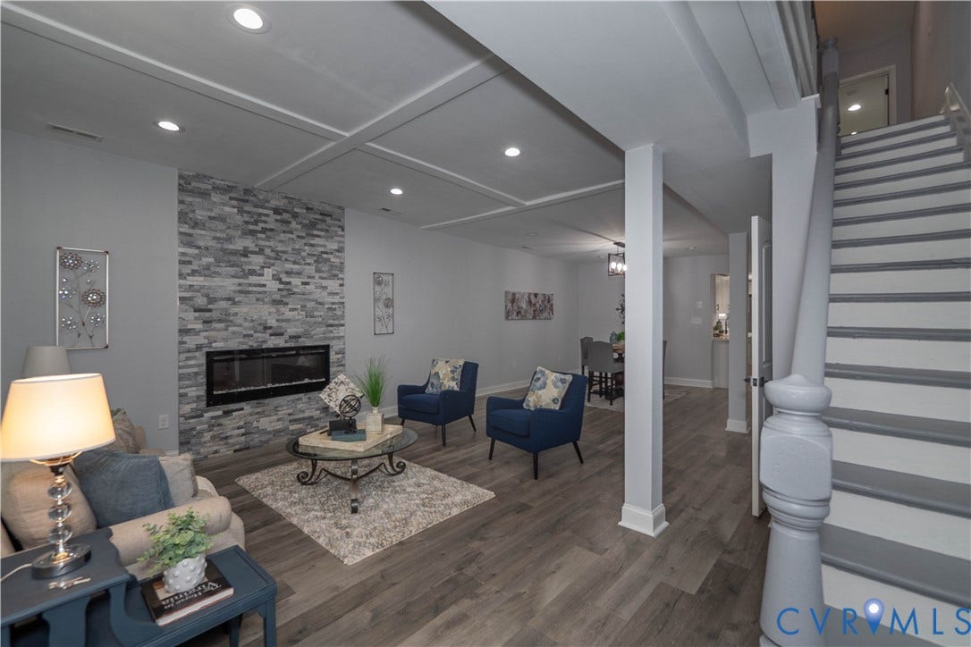 1209 N 22nd Street, Church Hill, Richmond, VA 23223 Living area featuring wood-finish flooring, a stacked stone fireplace with an electric insert, recessed lighting, and a coffered ceiling