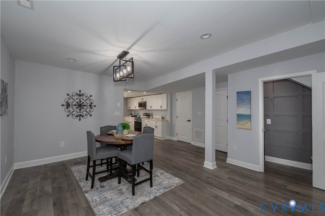 1209 N 22nd Street, Church Hill, Richmond, VA 23223 Spacious dining area with wood-finish flooring, recessed lighting, and a modern geometric chandelier