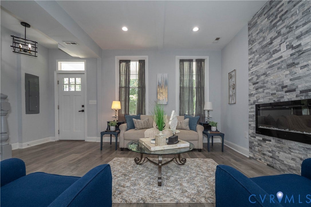 1209 N 22nd Street, Church Hill, Richmond, VA 23223 Living space featuring a stone-faced accent wall with an integrated electric fireplace, wood-finish flooring, and recessed lighting