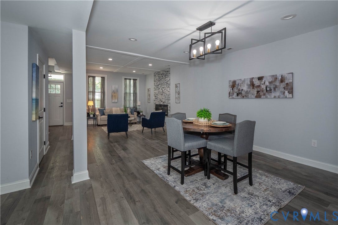 1209 N 22nd Street, Church Hill, Richmond, VA 23223 Open-concept interior featuring wood-finish flooring, a contemporary dining light fixture, recessed lighting, and a stone-clad fireplace