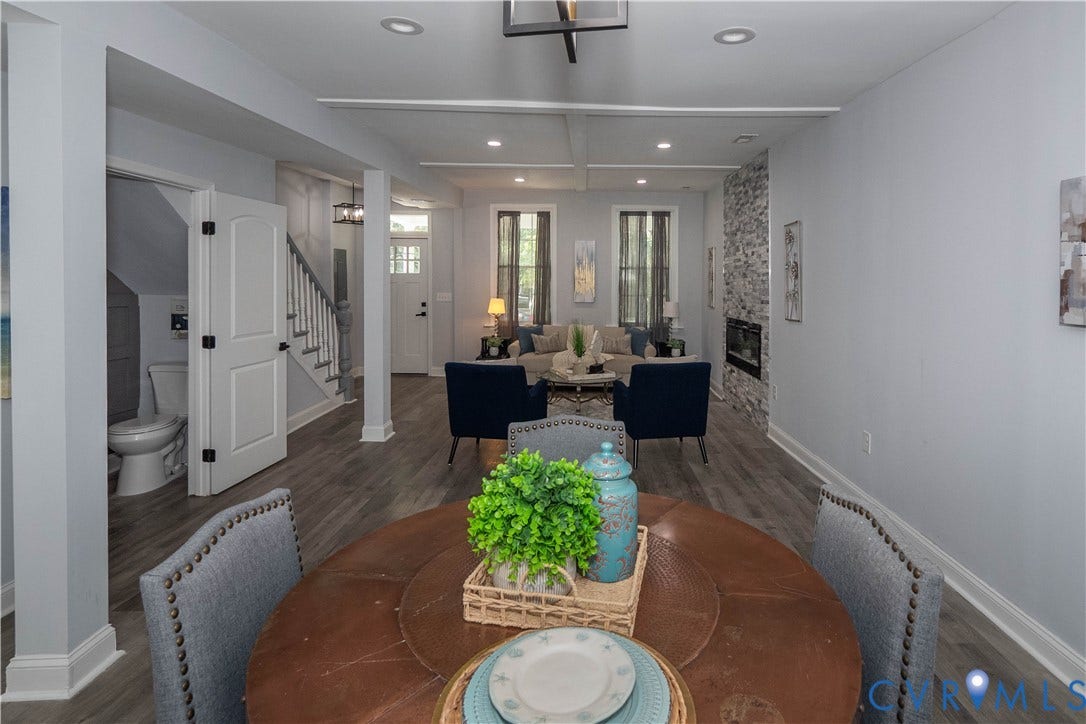 1209 N 22nd Street, Church Hill, Richmond, VA 23223 Open-concept interior featuring wood-finish flooring, recessed lighting, and a stacked stone fireplace with an electric insert