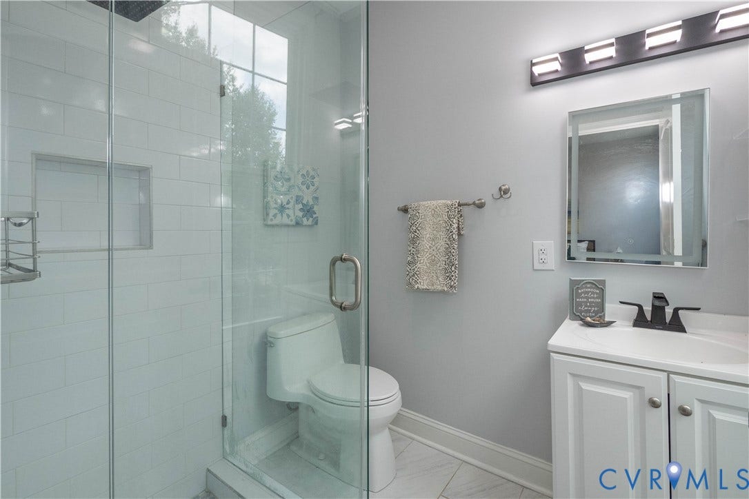 1209 N 22nd Street, Church Hill, Richmond, VA 23223 Full glass shower enclosure featuring white subway tile surround and built-in niche