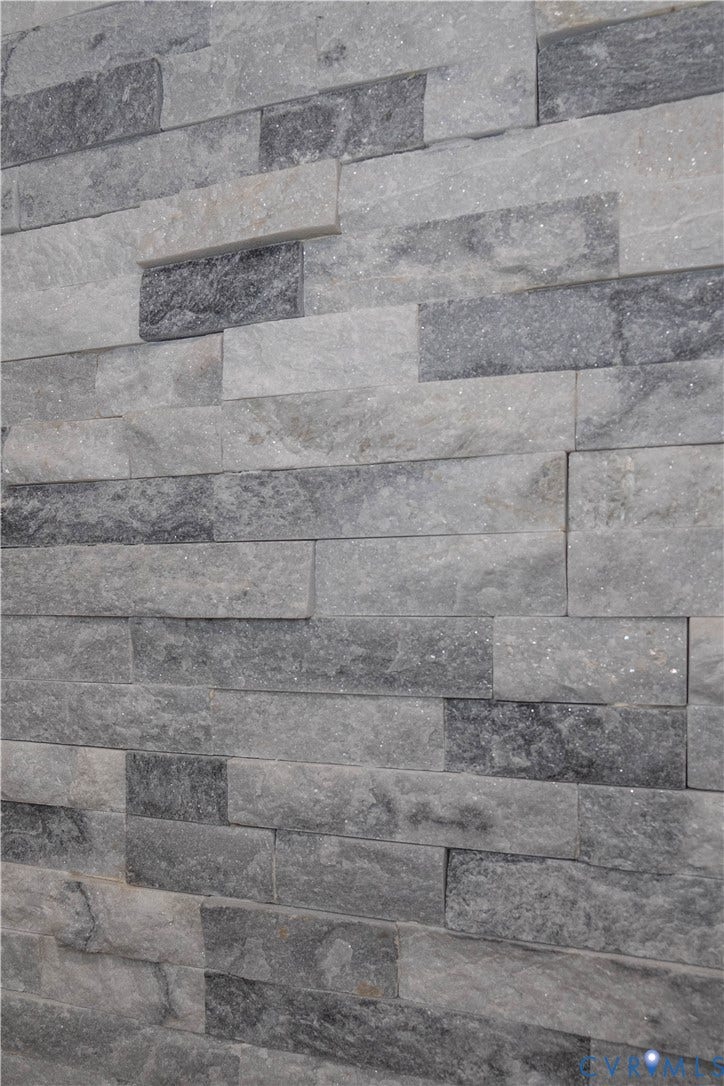 1209 N 22nd Street, Church Hill, Richmond, VA 23223 Stacked stone veneer featuring varied shades of grey and textured surfaces