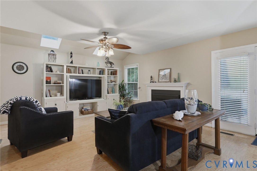 Large and Open-with Gas Fireplace and doors to Deck and Wrap Around Porch