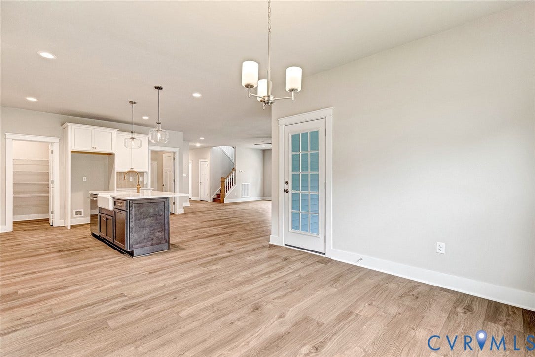 11101 Somerset Hill Drive, Somerset Hills, Glen Allen, VA 23059 Open-concept interior featuring wood-finish flooring, recessed lighting, and a kitchen island with seating