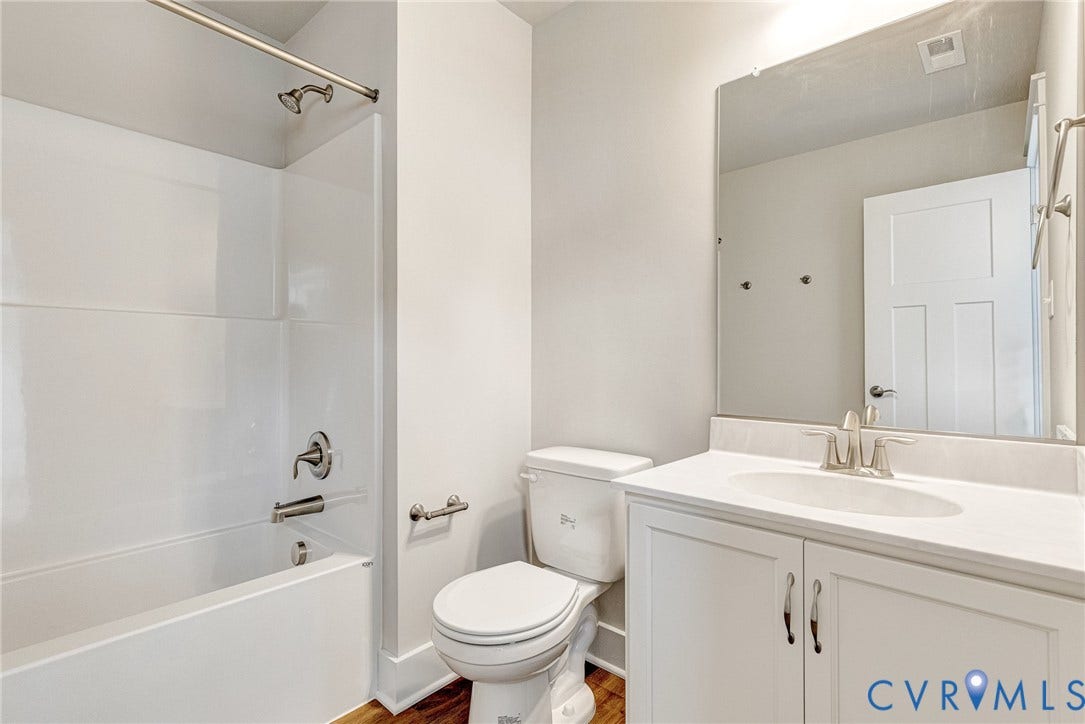 11101 Somerset Hill Drive, Somerset Hills, Glen Allen, VA 23059 White vanity with dual-door cabinetry, a single basin sink, and a countertop