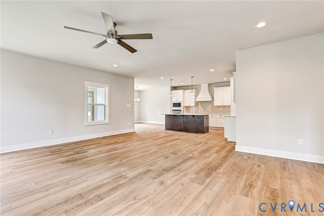 11101 Somerset Hill Drive, Somerset Hills, Glen Allen, VA 23059 Expansive open-concept living space with wood-finish flooring, recessed lighting, and a modern ceiling fan