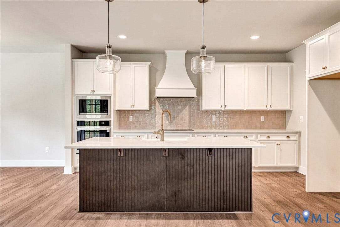 11101 Somerset Hill Drive, Somerset Hills, Glen Allen, VA 23059 Kitchen featuring a central island with a light-toned countertop, white cabinetry, integrated wall oven and microwave, decorative range hood, and wood-finish flooring