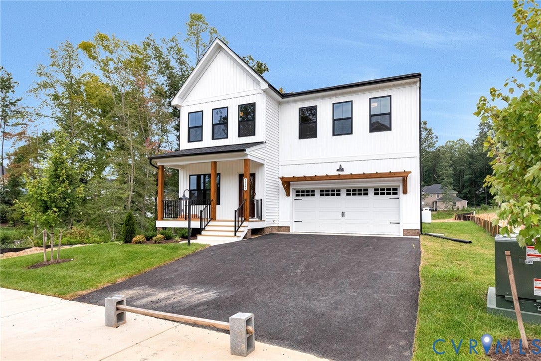 11101 Somerset Hill Drive, Somerset Hills, Glen Allen, VA 23059 Modern farmhouse-inspired exterior with white siding, black-framed windows, a covered front porch with wood columns, an attached garage with a decorative pergola, and a paved driveway